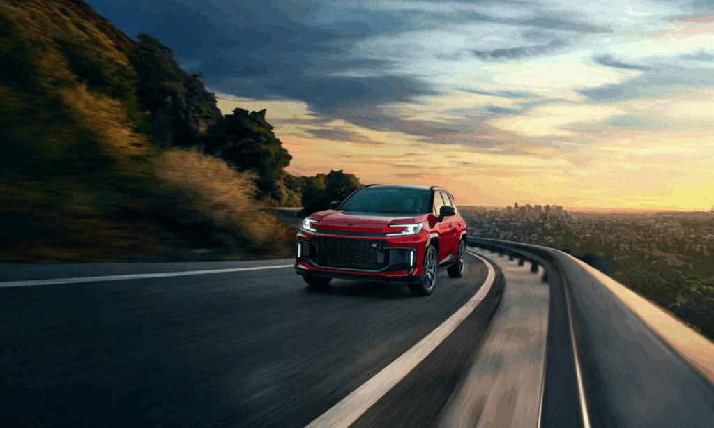 Red 2026 Toyota RAV4 plug in hybrid driving down road