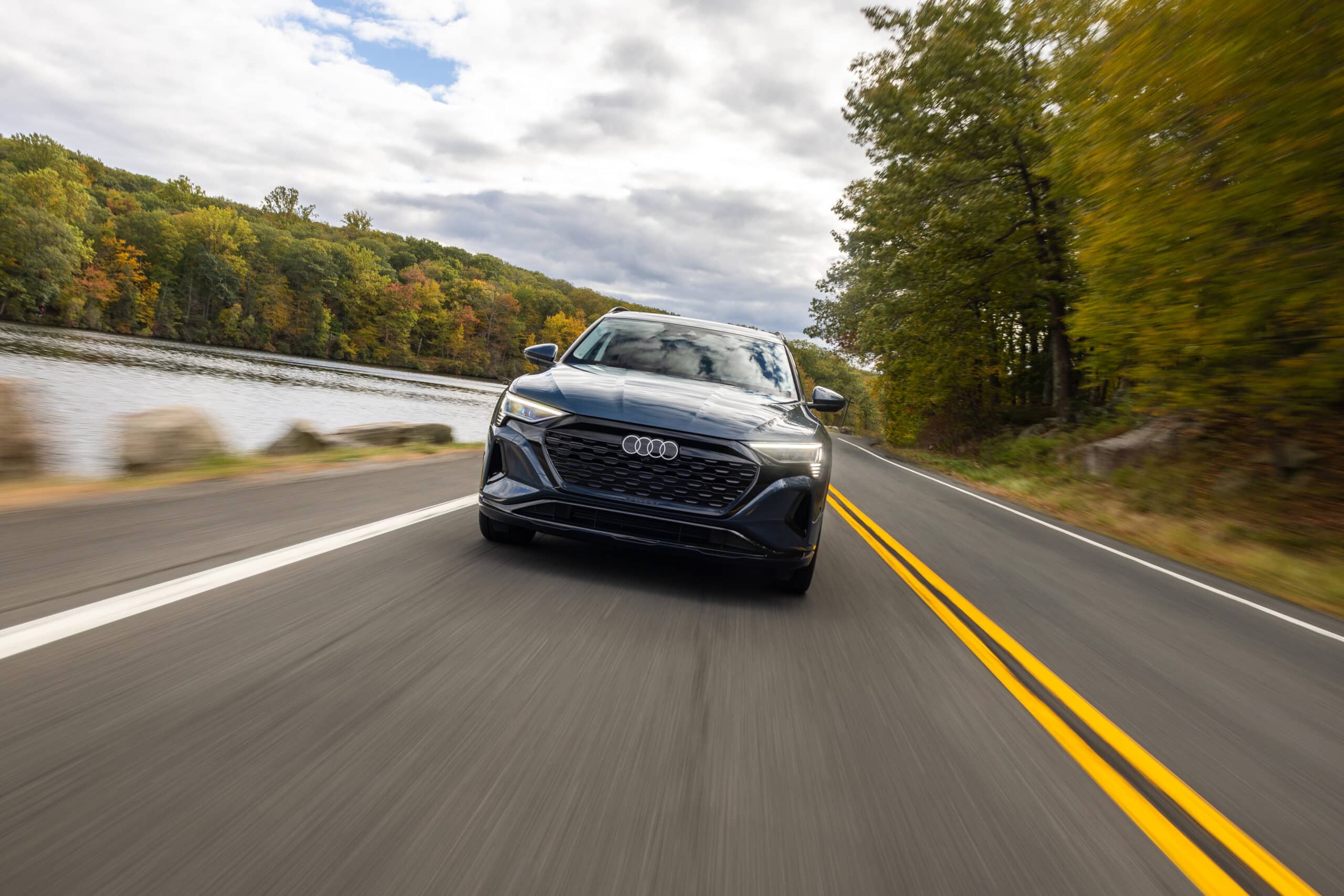 2024 Audi Q8 e-tron driving down the road
