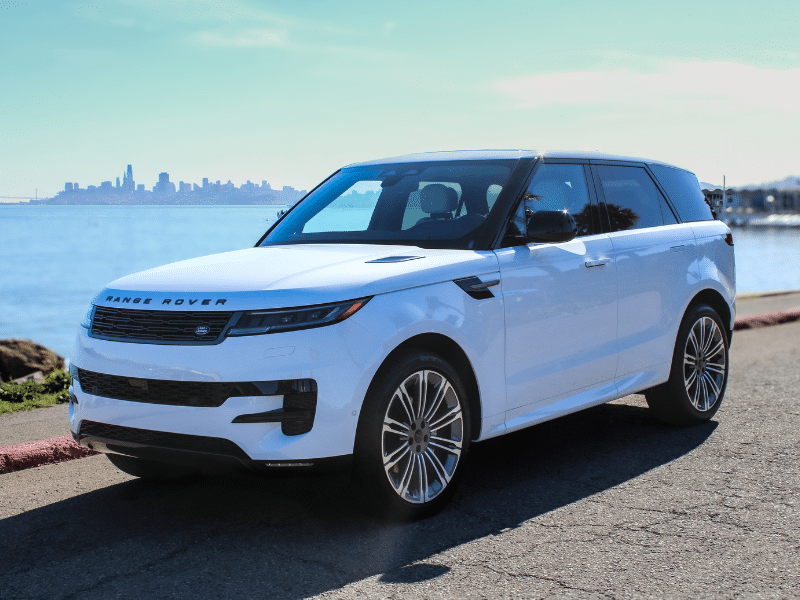 White Land Rover Range Rover Sport 2026 shot by Cartelligent in front of San Francisco skyline